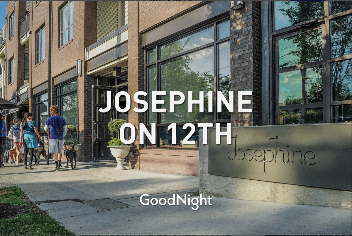 The building’s exterior entrance with clear signage, vibrant planters, and people strolling or walking dogs. The scene feels lively and welcoming, connecting the condo to its urban, pet-friendly neighborhood.